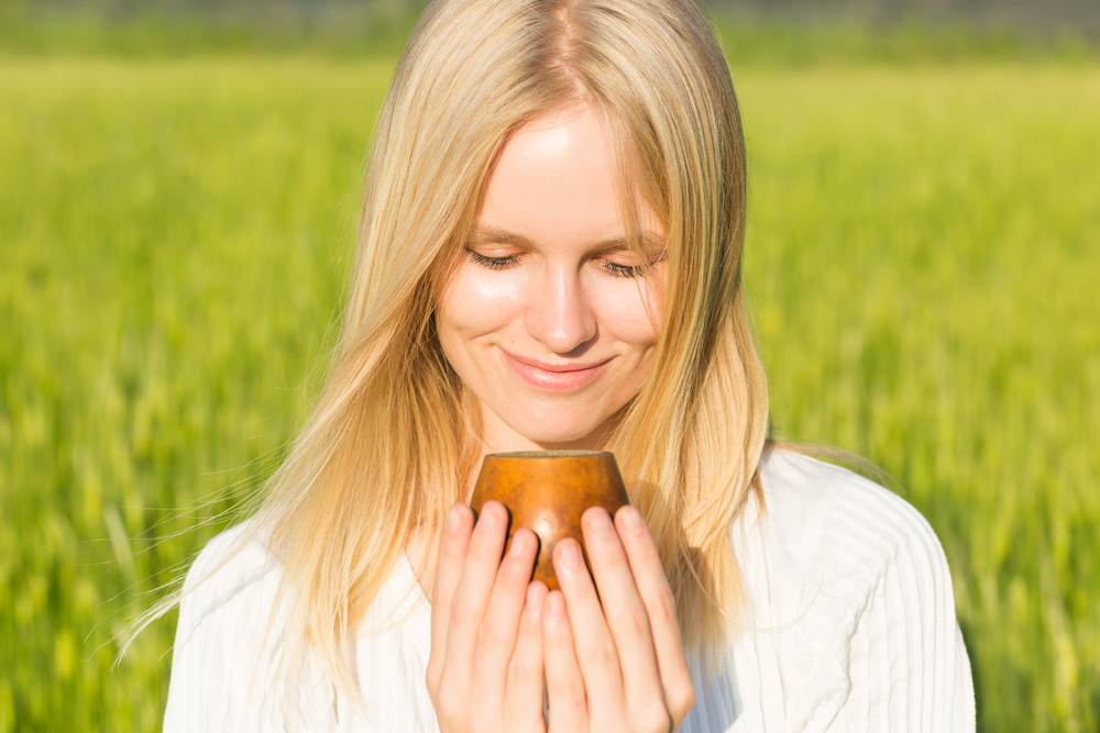 Beautiful,Young,Woman,Drinking,Fresh,Tea,In,A,Wooden,Cup Beautiful,Young,Woman,Drinking,Fresh,Tea,In,A,Wooden,Cup