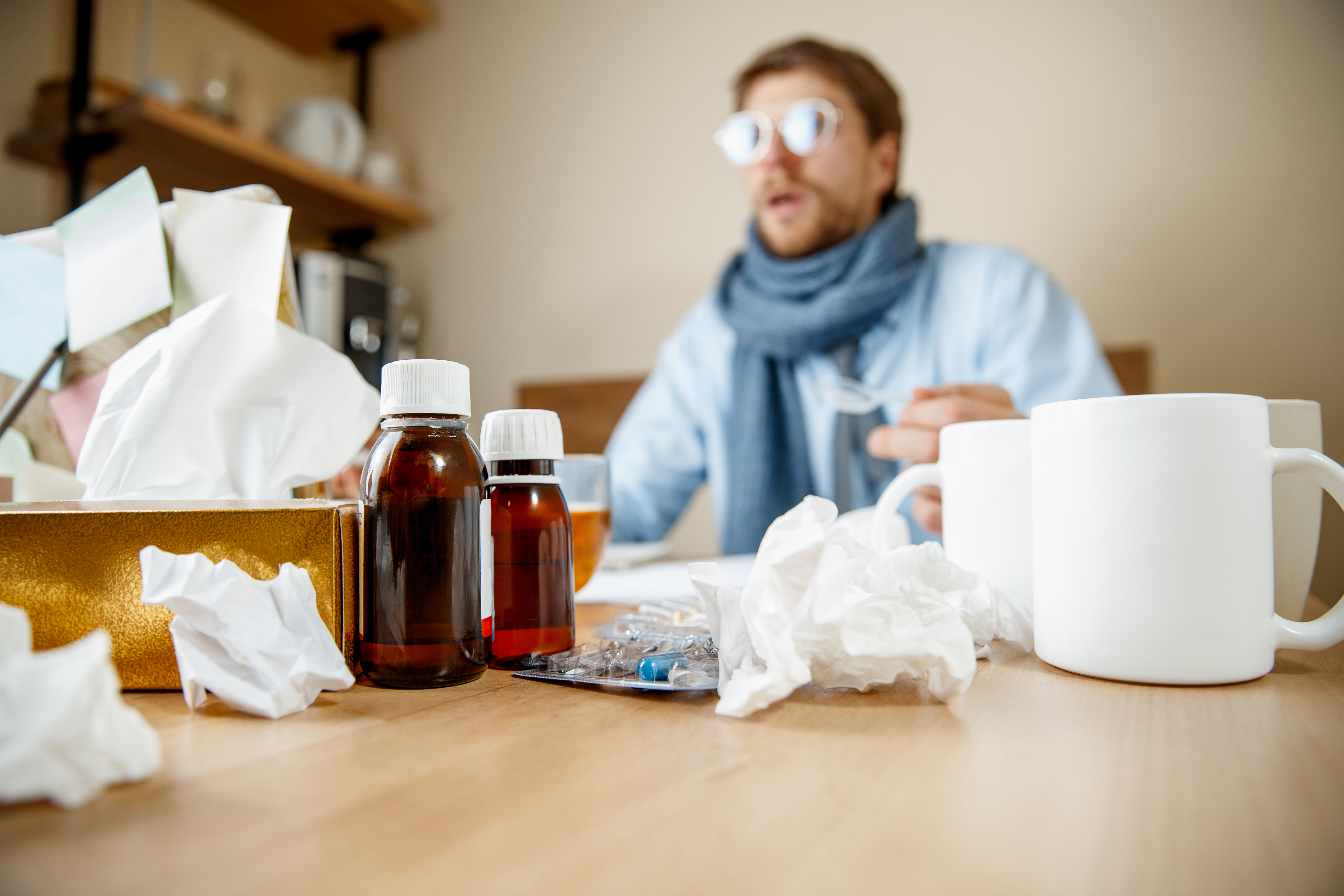 Sick man while working in office, businessman caught cold, seasonal flu. Sick man while working in office, businessman caught cold, seasonal flu.