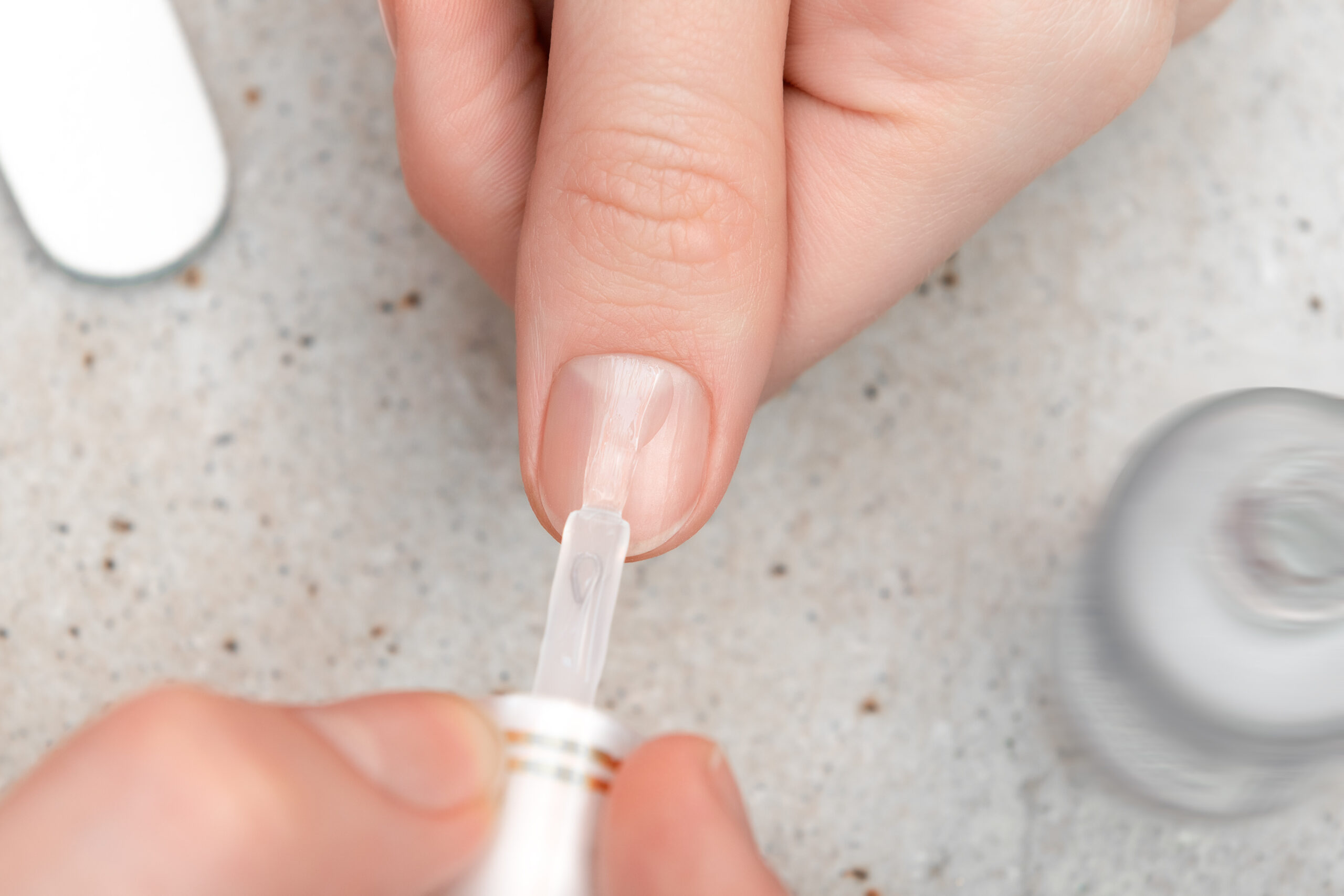 Girl doing manicure by herself, close up. Girl doing manicure by herself, close up.