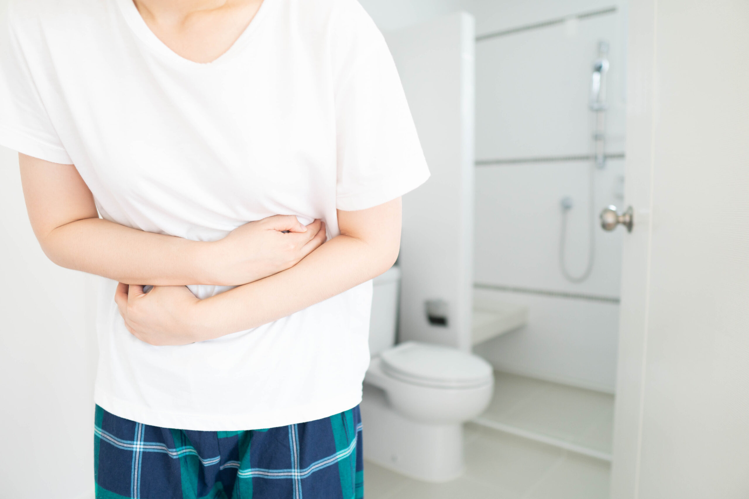 Young,Female,Suffering,Form,Abdominal,Pain,In,Front,Of,Toilet Young,Female,Suffering,Form,Abdominal,Pain,In,Front,Of,Toilet