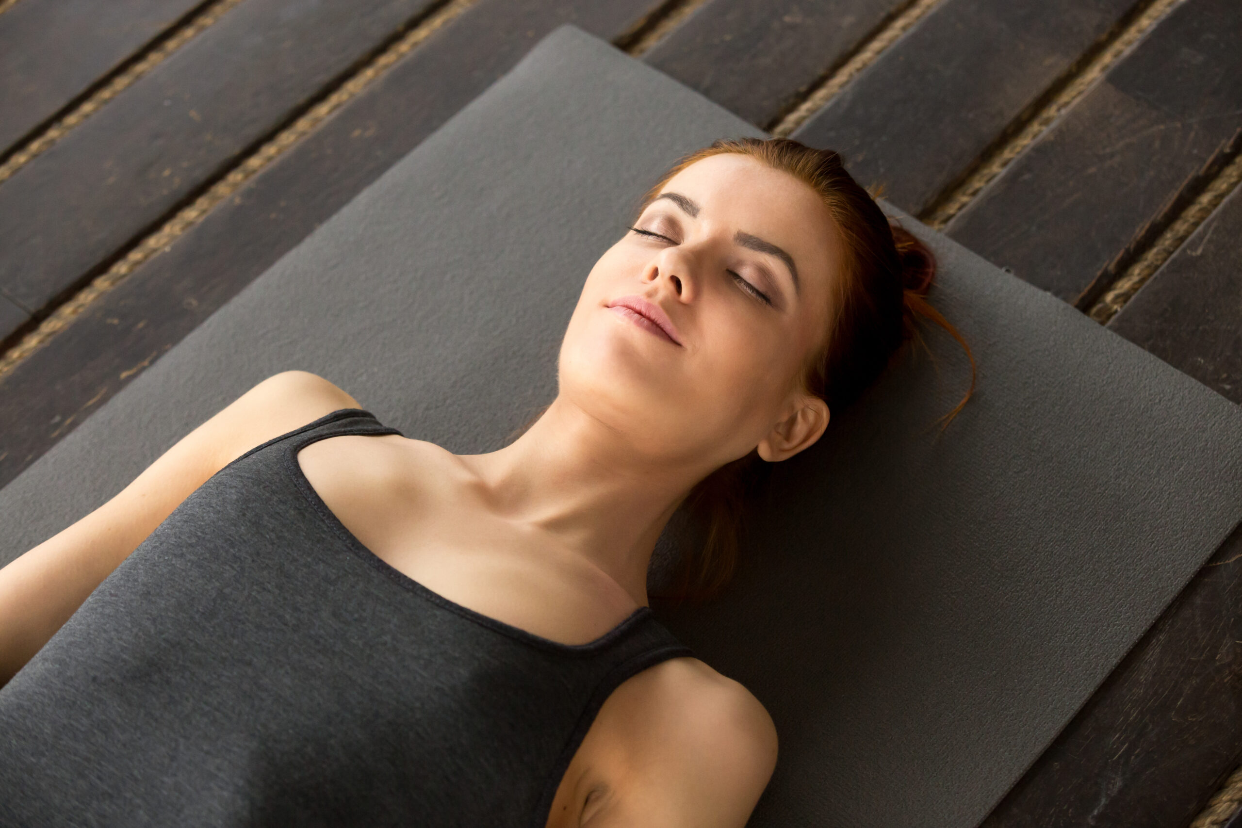 Young attractive woman lying in Dead Body exercise Young attractive woman lying in Dead Body exercise