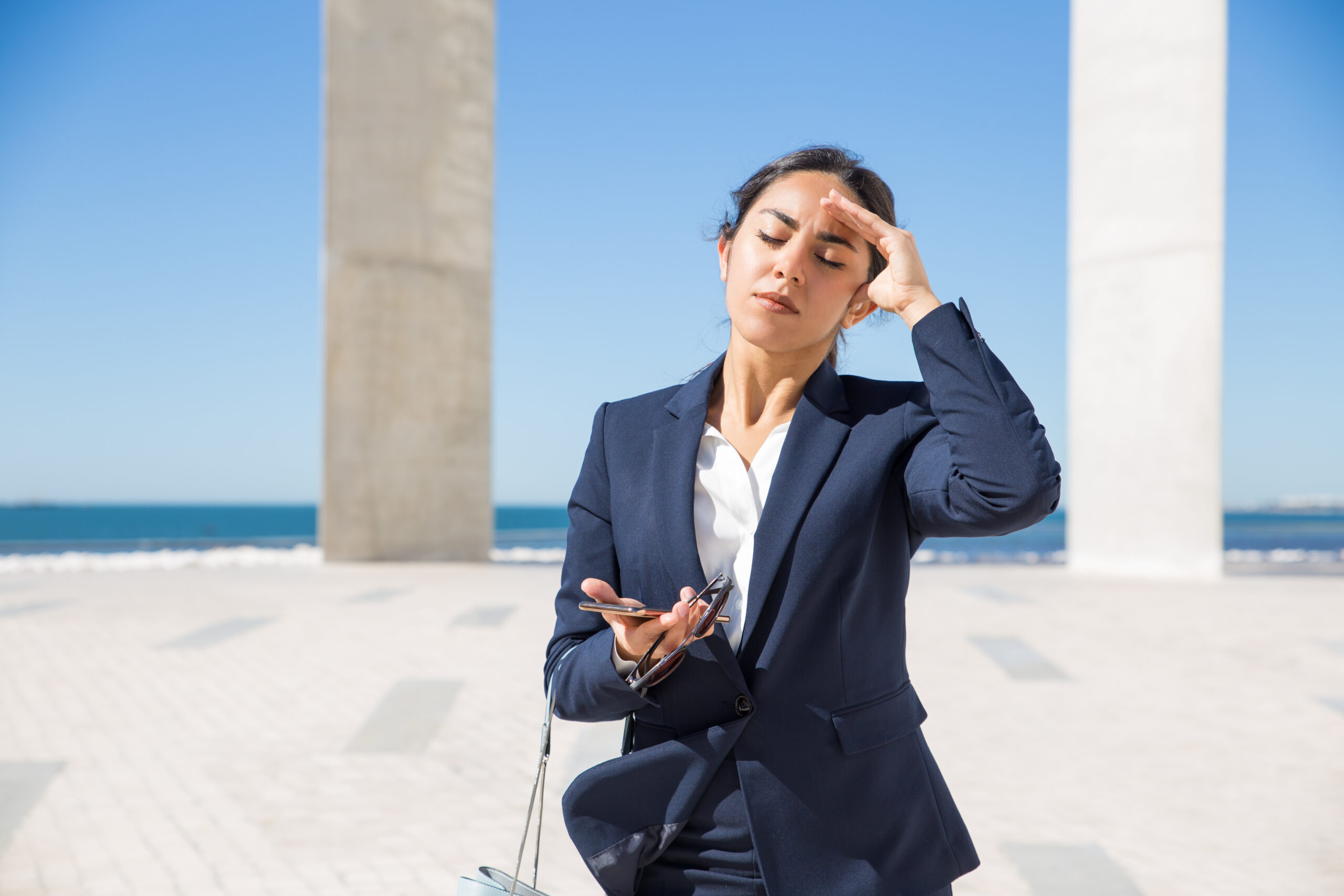 Frustrated business lady suffering from heat Frustrated business lady suffering from heat