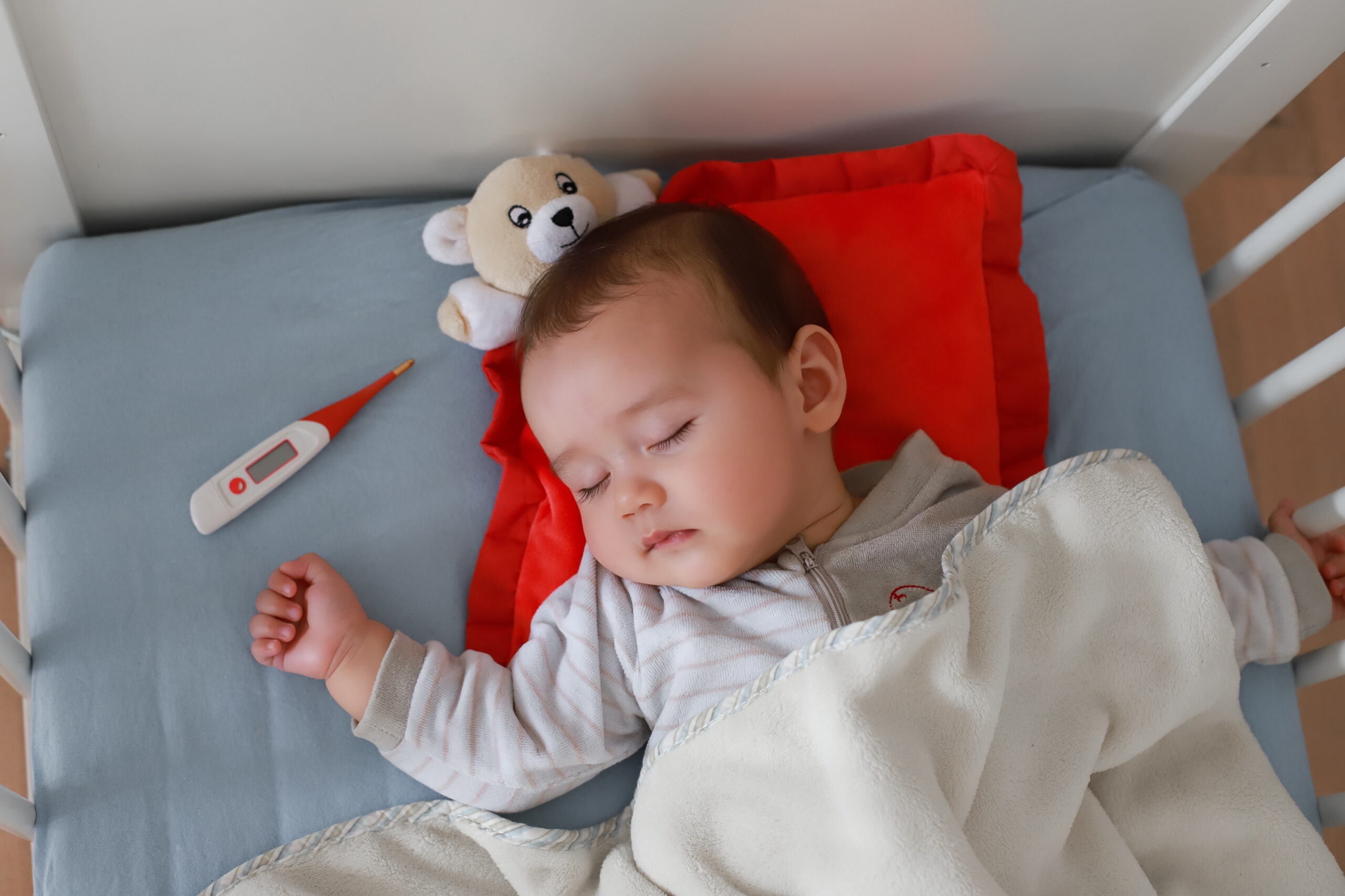 Baby,Boy,Sick,Sleep,In,Cot,Next,To,Digital,Thermometer. Baby,Boy,Sick,Sleep,In,Cot,Next,To,Digital,Thermometer.