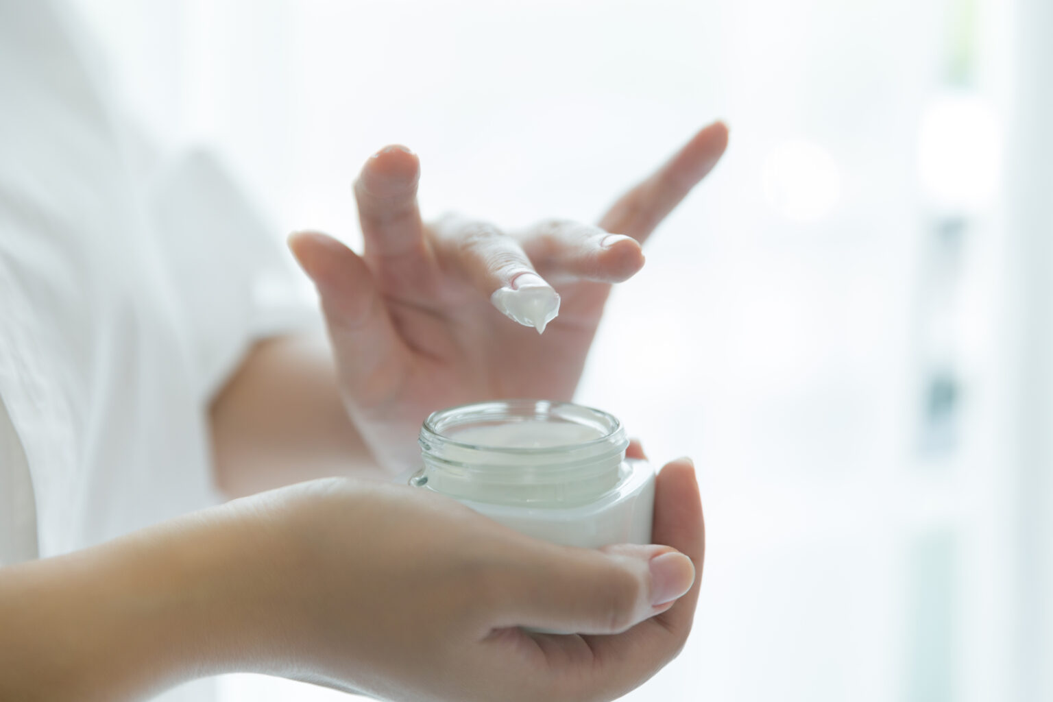 woman holds a jar with a cosmetic cream in her hands. skin care woman holds a jar with a cosmetic cream in her hands. skin care