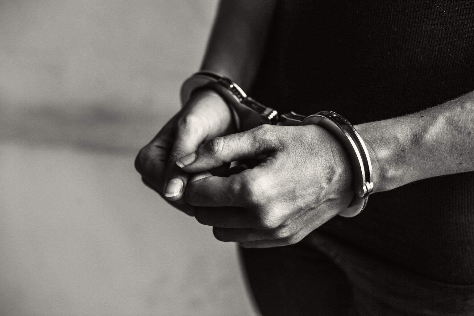 Criminal in handcuffs Criminal in handcuffs