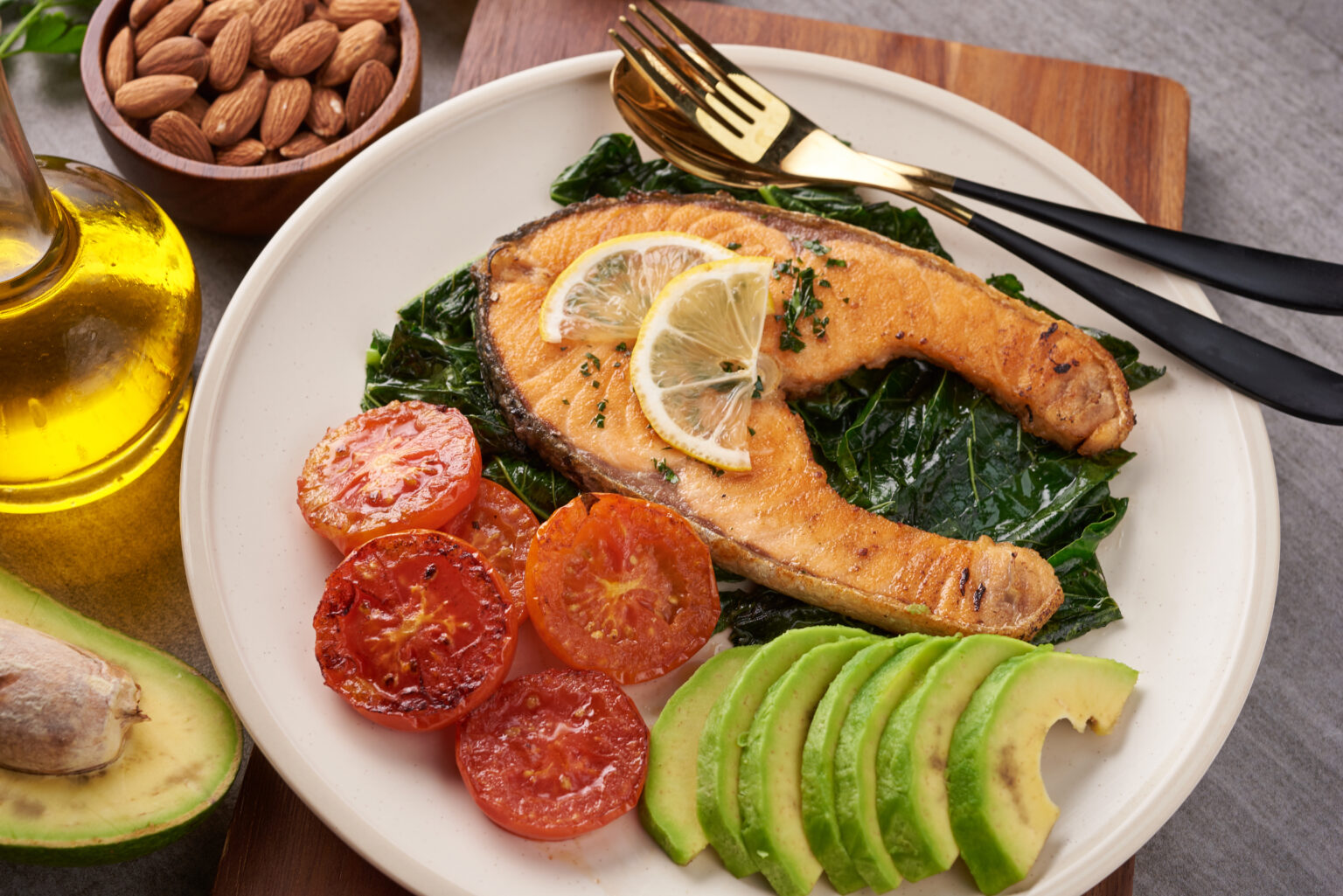 Grilled salmon fish fillet and fresh green lettuce vegetable tom Grilled salmon fish fillet and fresh green lettuce vegetable tom