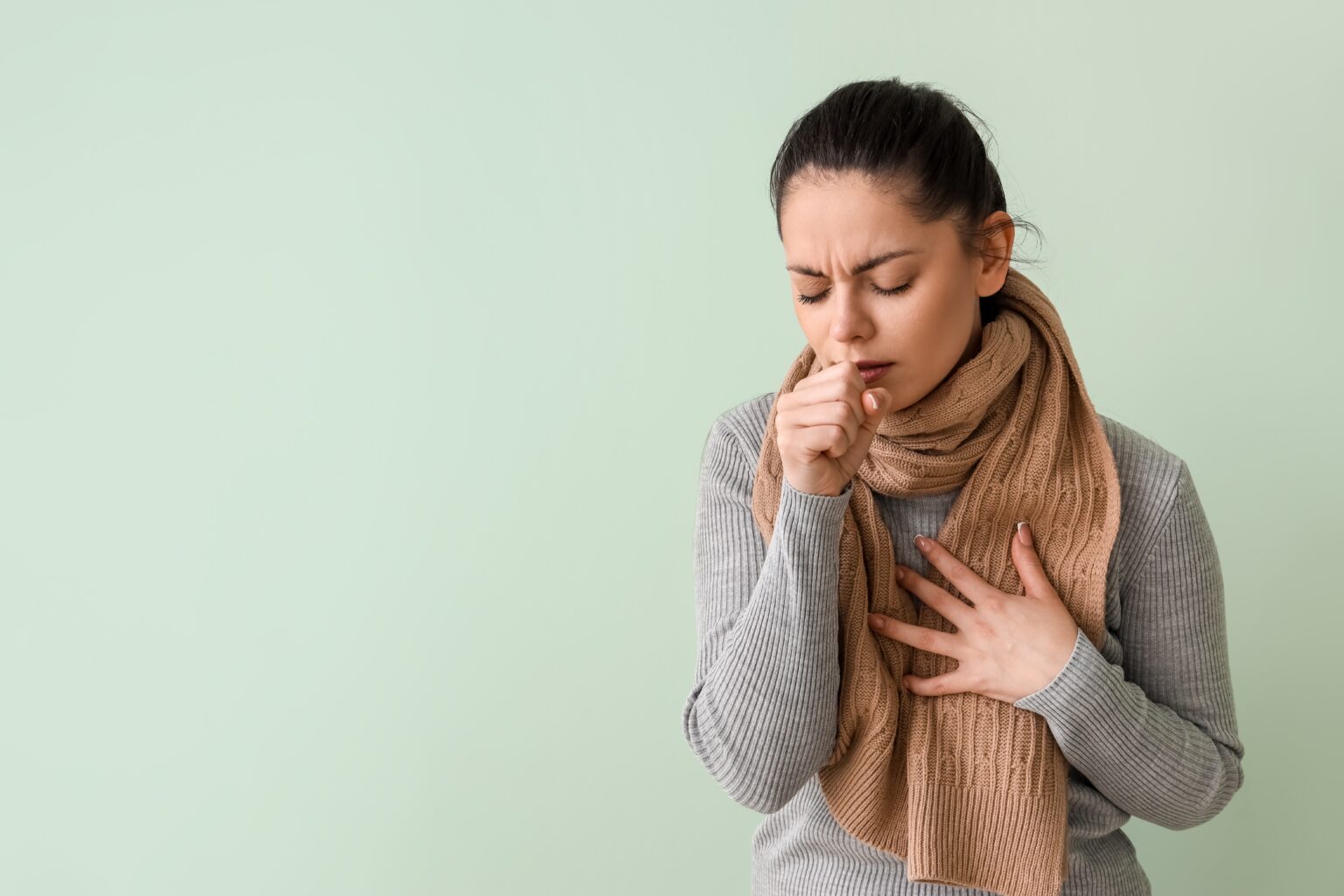 Ill,Young,Woman,Coughing,On,Green,Background Ill,Young,Woman,Coughing,On,Green,Background