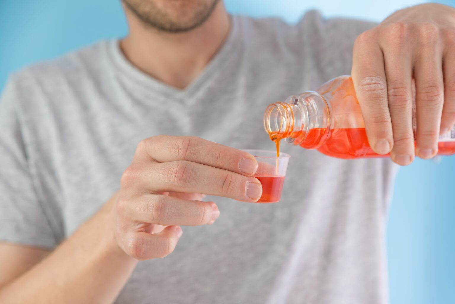 Man,Poring,Portion,Of,Liquid,Medicine,Syrup,For,Treatment,Cold Man,Poring,Portion,Of,Liquid,Medicine,Syrup,For,Treatment,Cold