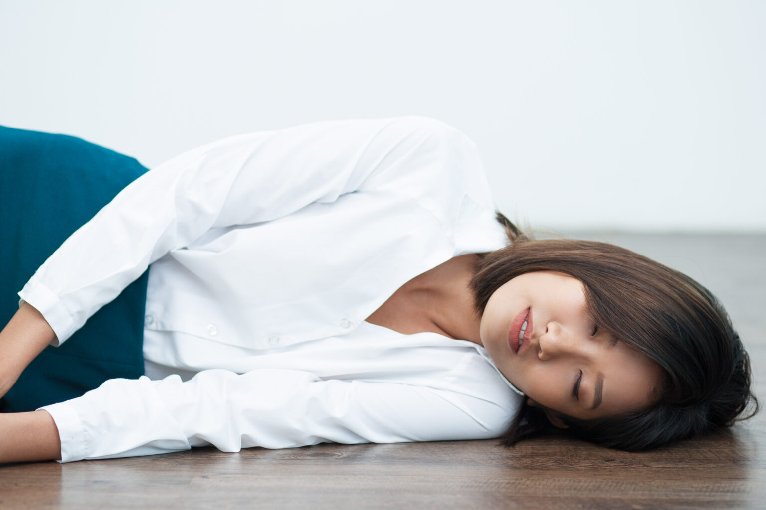 Closeup of Young Asian Woman Sleeping on Floor