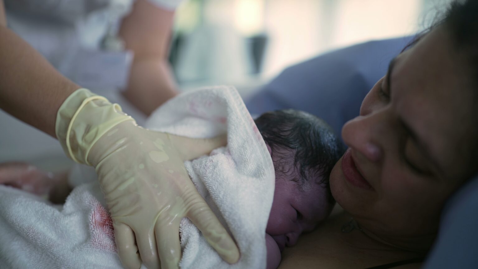 Nurse’s,Hand,Trying,To,Make,Newborn,Baby,Cry,Right,After