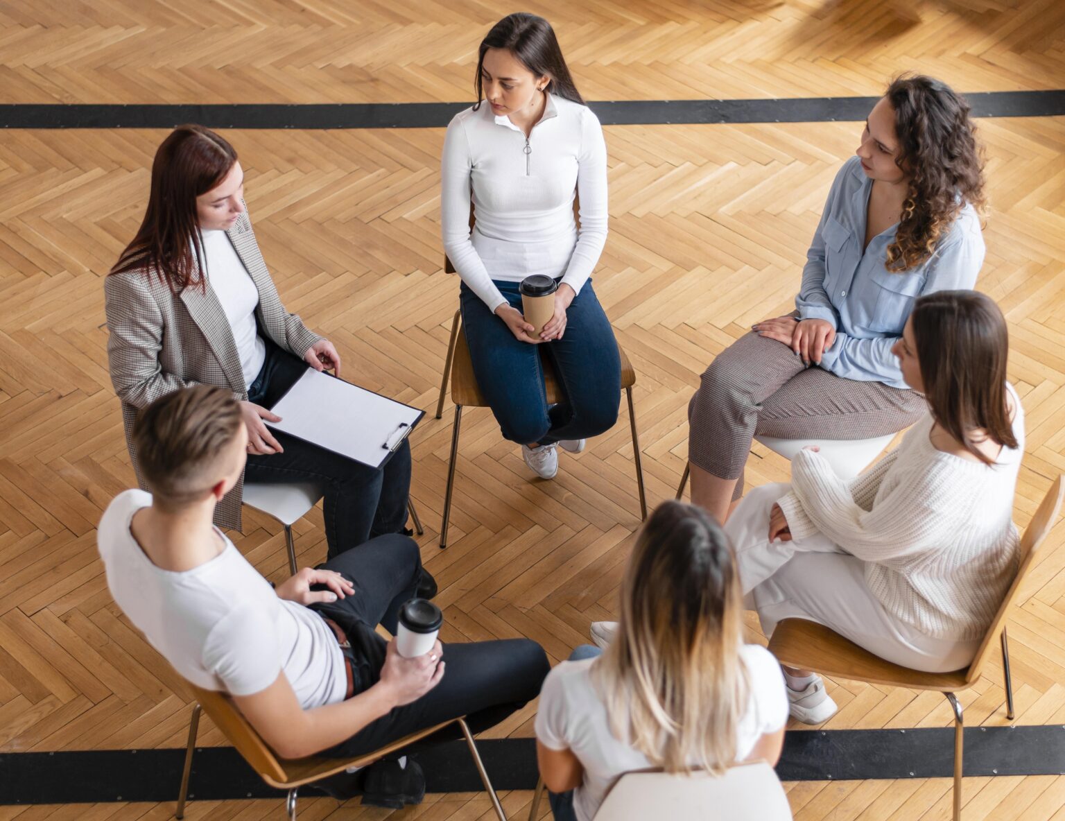 medium-shot-people-sitting-circle medium-shot-people-sitting-circle