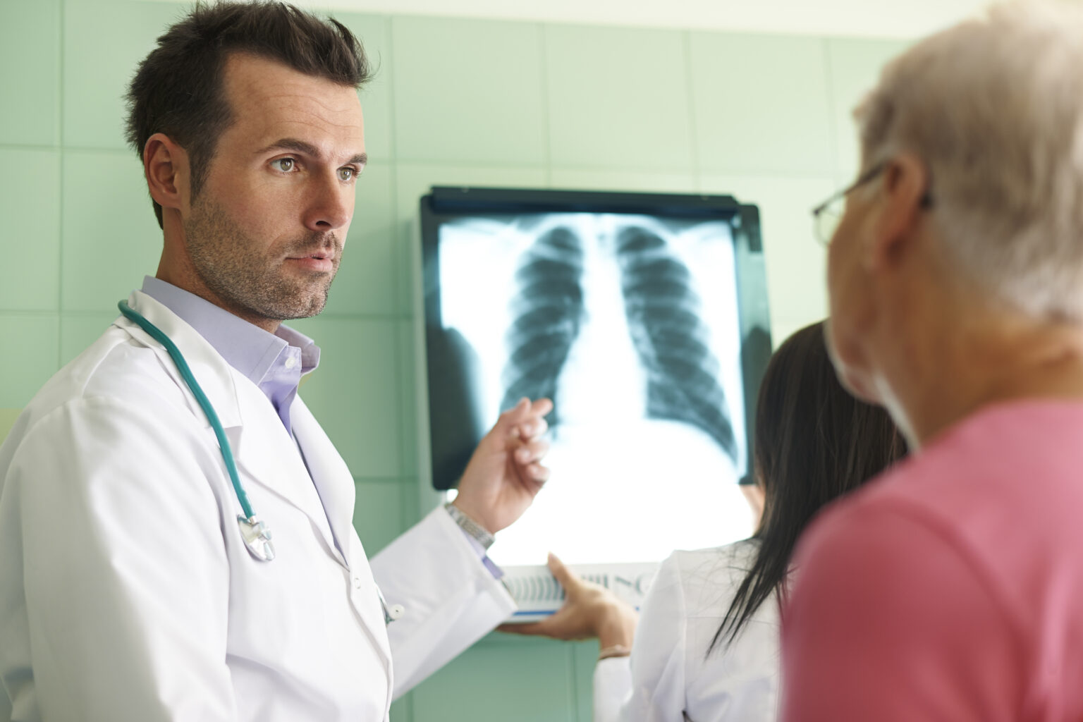 Analyzing x-ray image in the hospital Analyzing x-ray image in the hospital