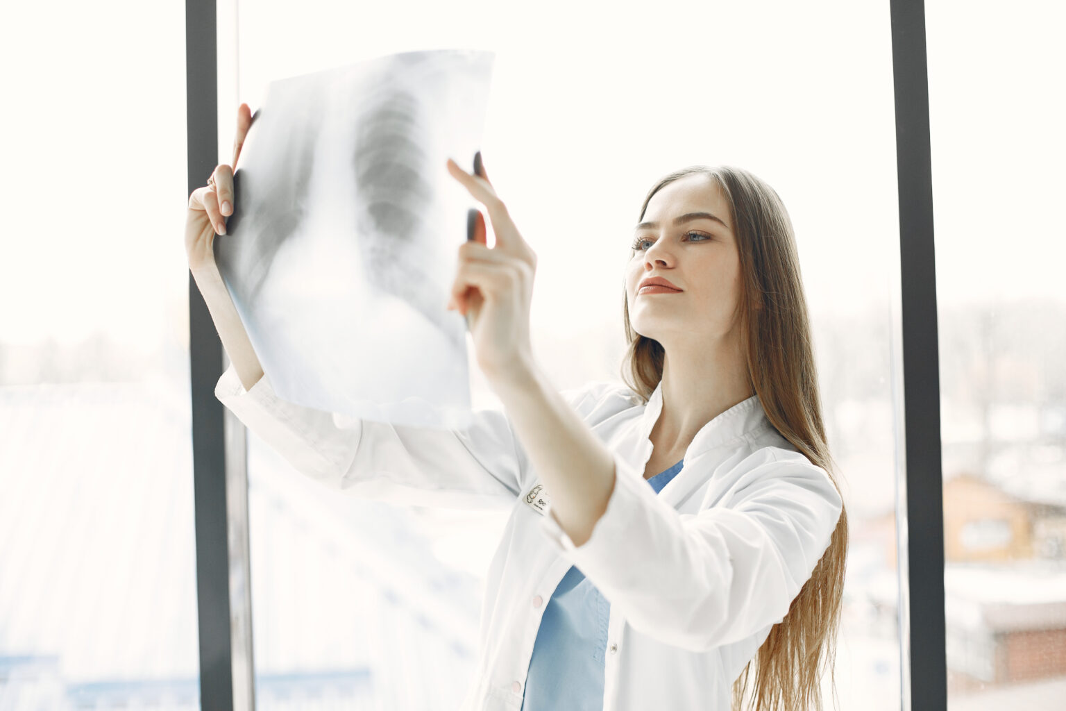 Doctor looks at a person’s x-ray Doctor looks at a person’s x-ray