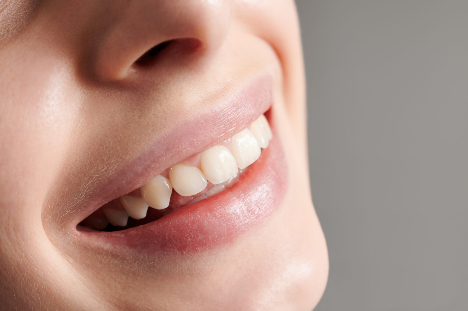 Beautiful female smile with white straight teeth. Beautiful female smile with white straight teeth.
