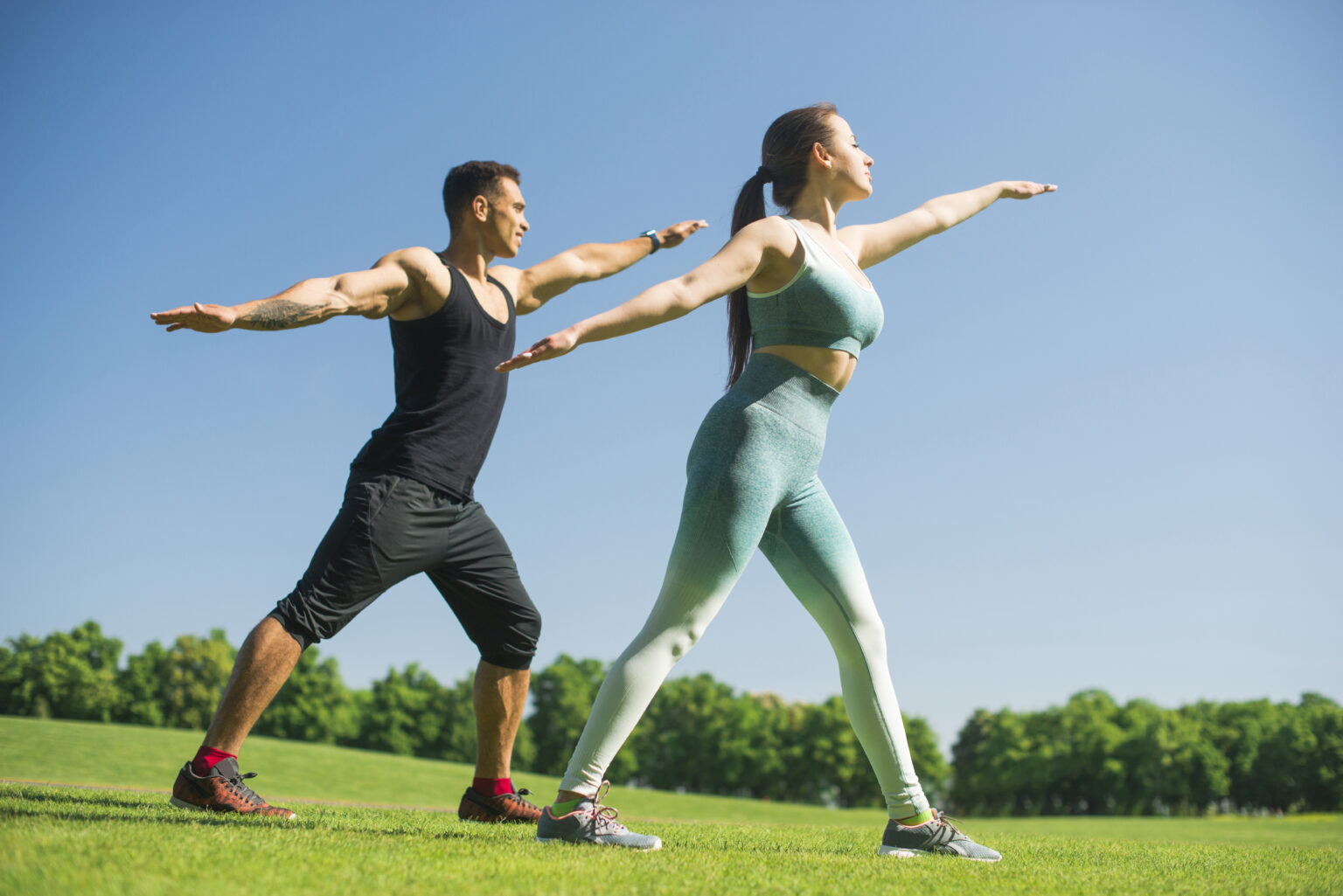 man-woman-practicing-yoga-outdoor man-woman-practicing-yoga-outdoor