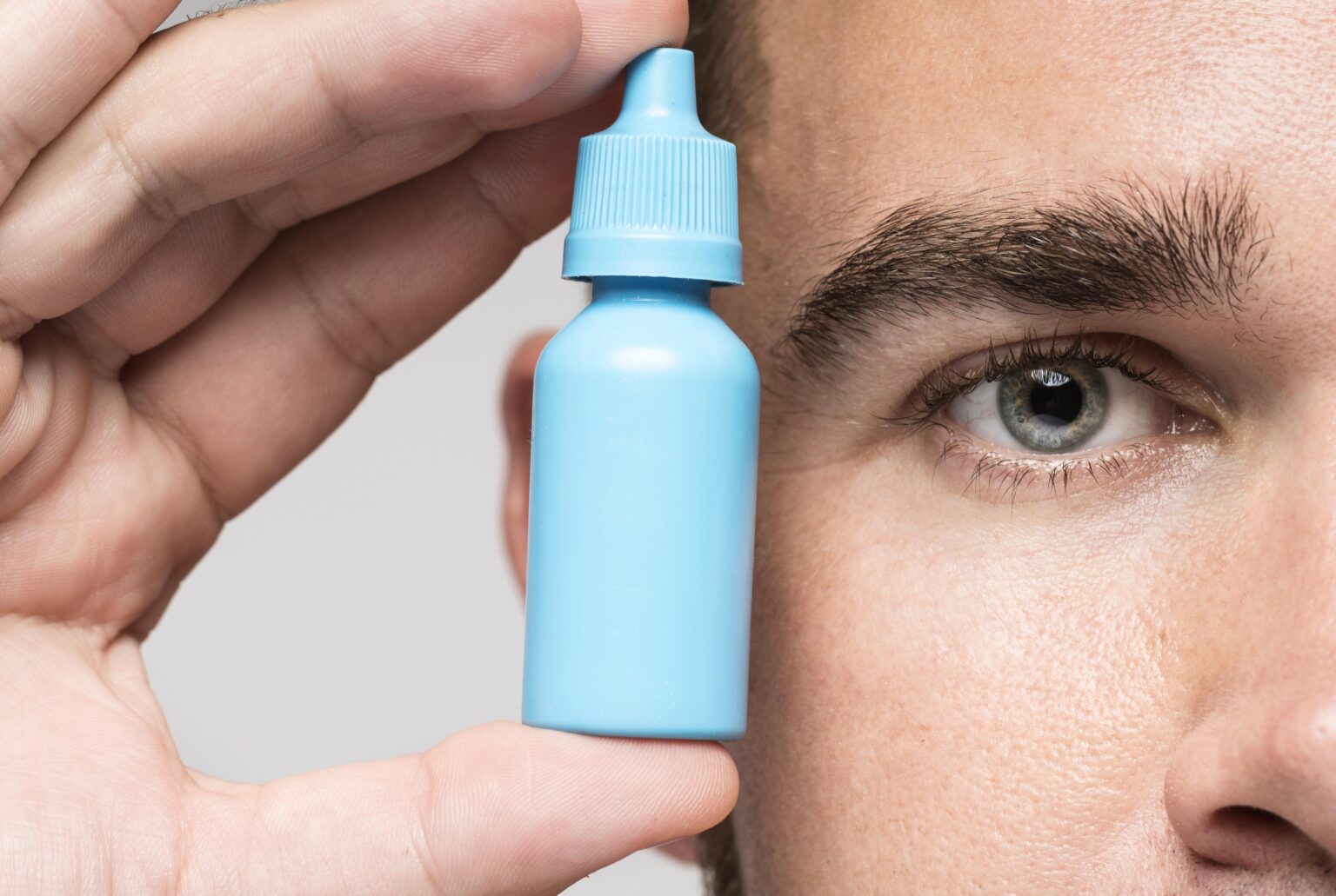 man-holding-medicinal-bottle man-holding-medicinal-bottle