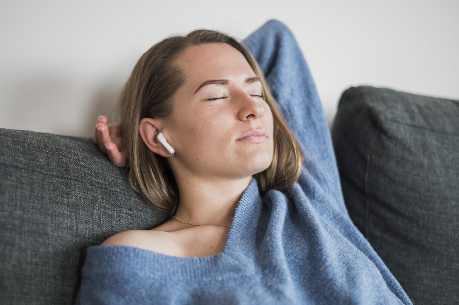 low-angle-woman-relaxing-couch low-angle-woman-relaxing-couch